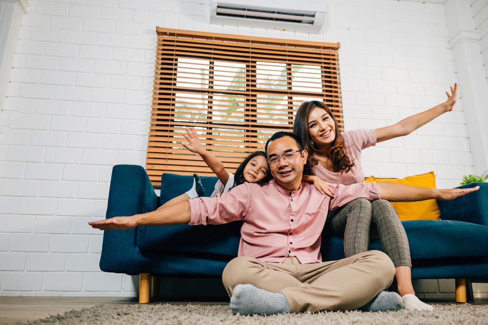 Parents setting AC temperature to reduce electricity bills